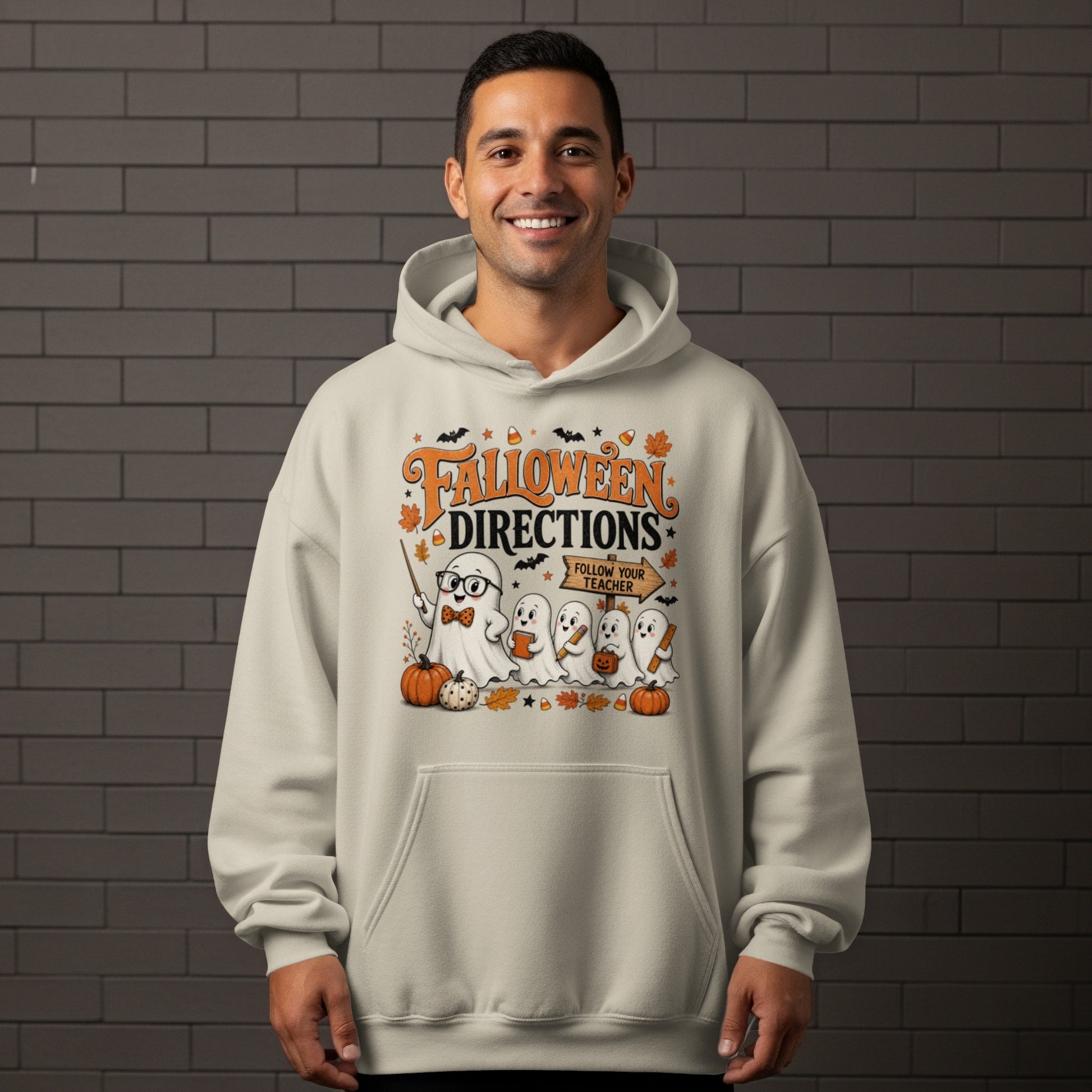 Ghost teacher with sign "Follow Your Teacher" on a light-colored hoodie.