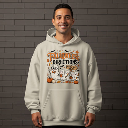 Ghost teacher with sign "Follow Your Teacher" on a light-colored hoodie.