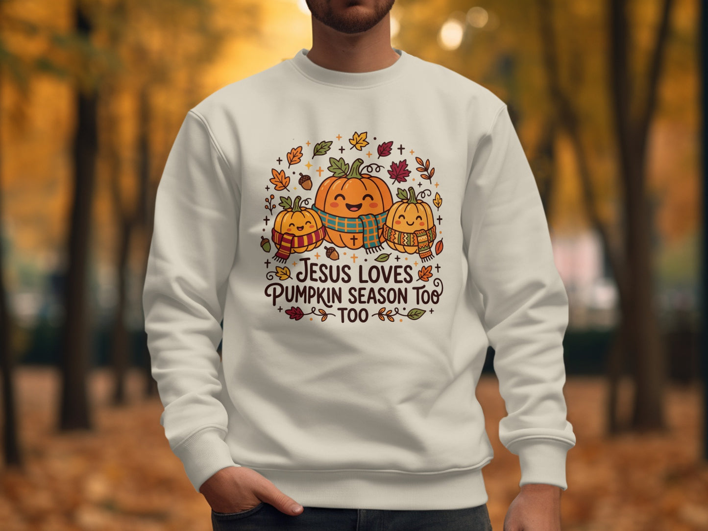 Crewneck sweatshirt with pumpkins, leaves, and "Jesus Loves Pumpkin Season Too" text.