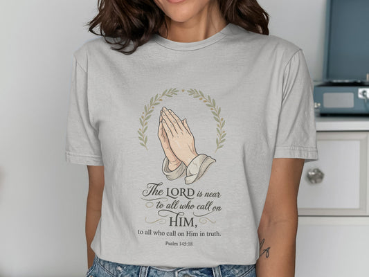 T-shirt with praying hands, wreath, and "The LORD is near" scripture.