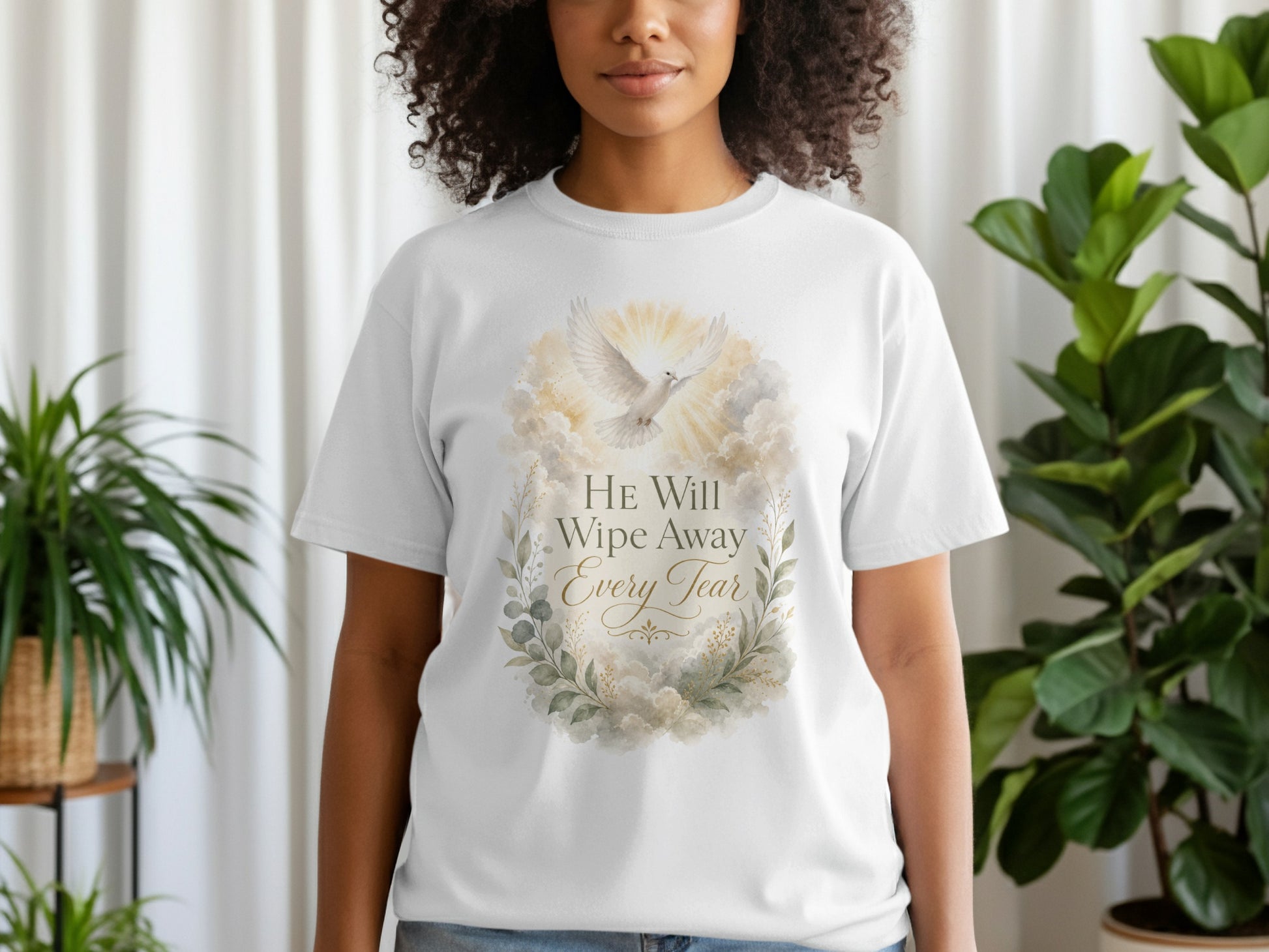 White t-shirt with watercolor dove and text: "HE Will Wipe Away Every Tear."