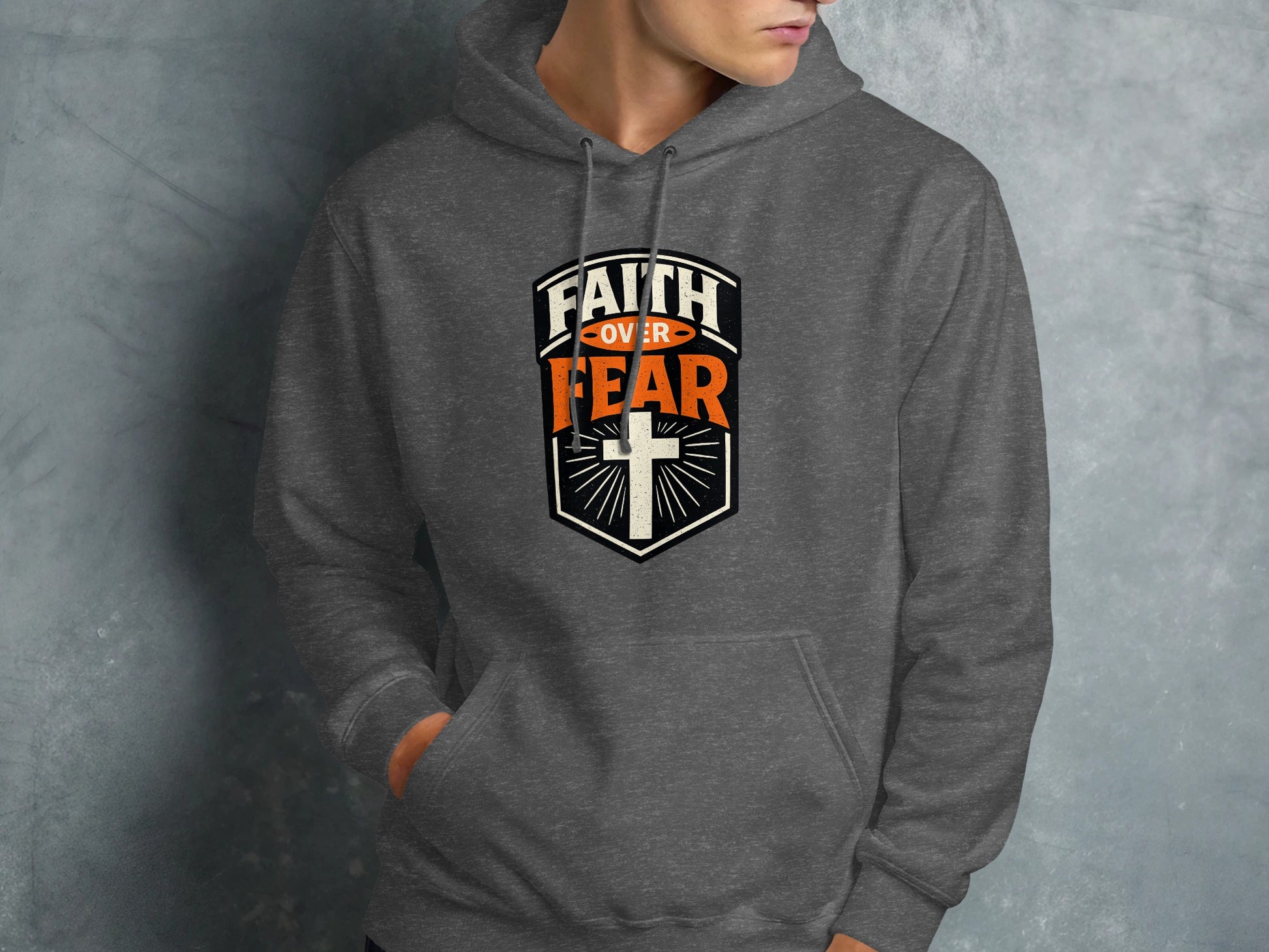 Dark gray hoodie with "Faith Over Fear" and a cross emblem.