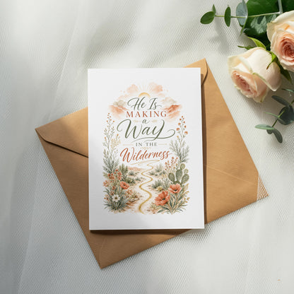 Card with "He Is Making a Way In The Wilderness" text and desert florals.