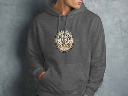 Dark grey hoodie with "Trust in the Lord" emblem and Proverbs 3:5.