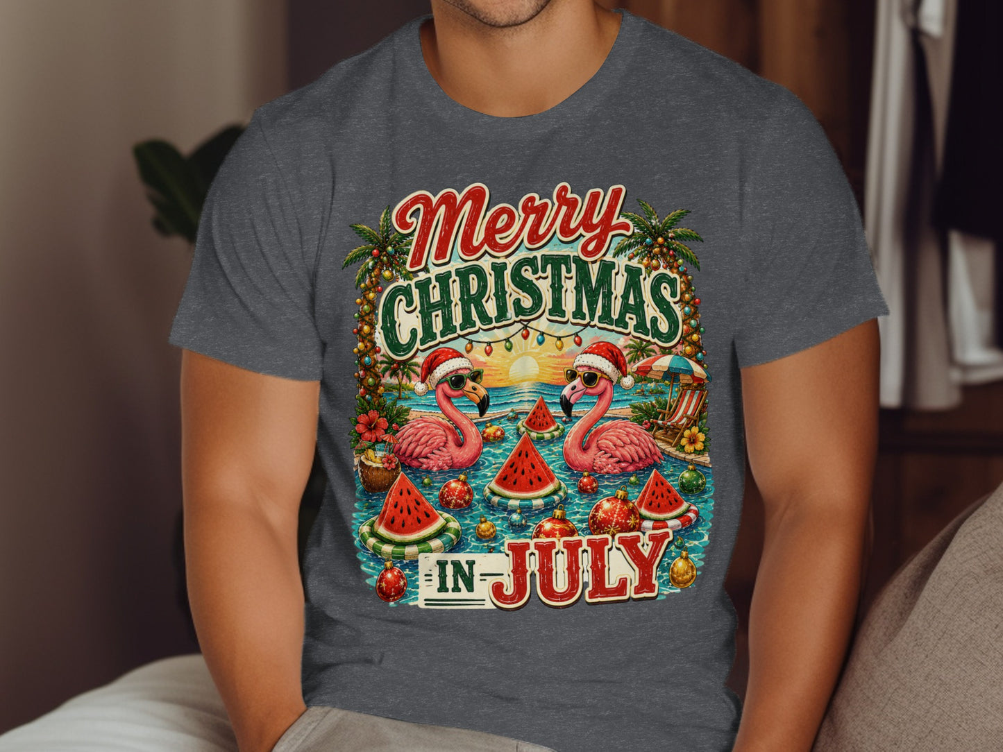 Merry Christmas in July graphic tee with flamingos, watermelon, and palm trees.