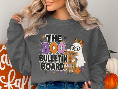 Ghost holding a bulletin board with "The Boo Bulletin Board" text and Halloween graphics.
