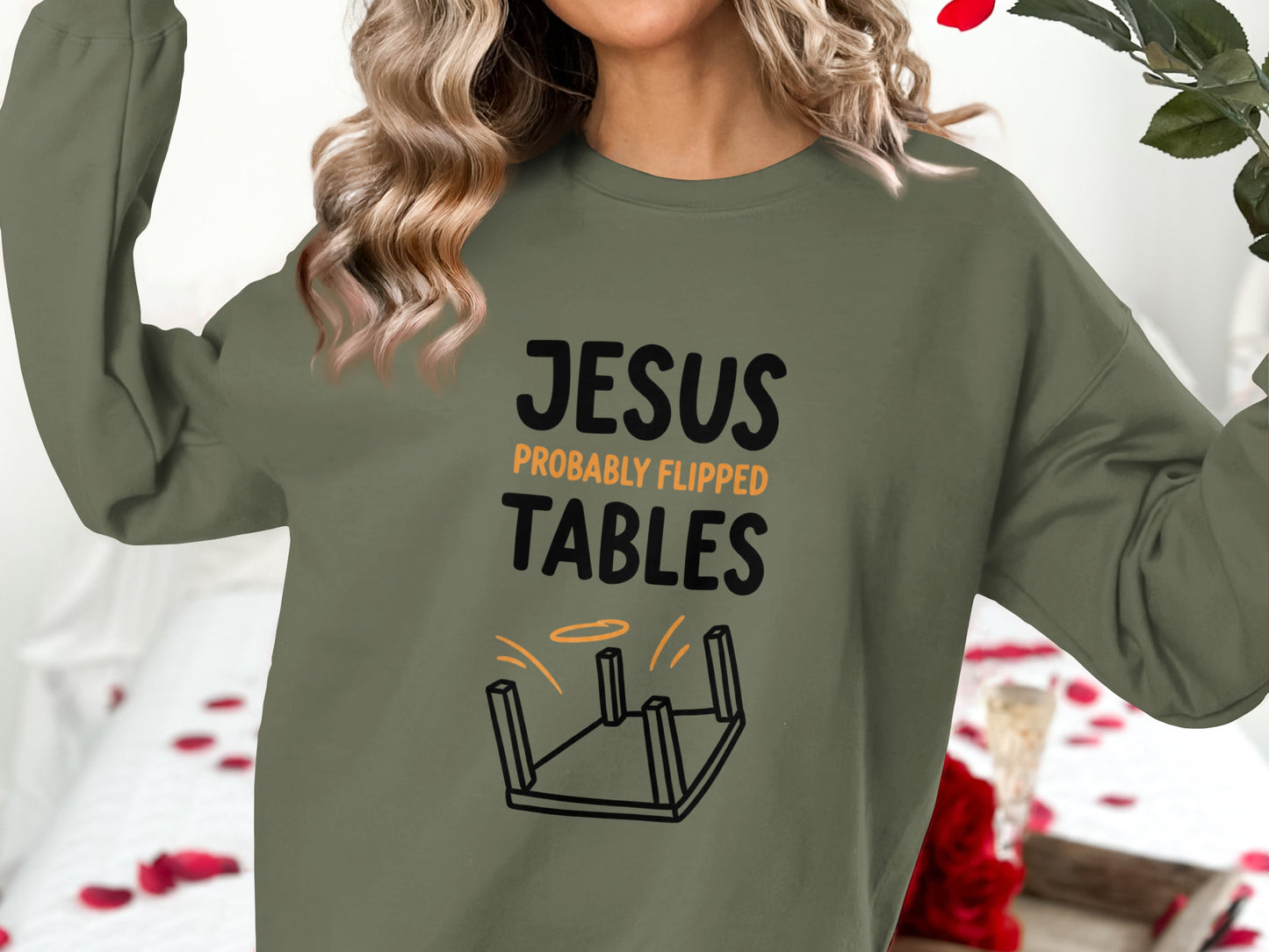Olive green sweatshirt with "Jesus Probably Flipped Tables" text and overturned table graphic.