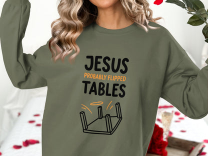 Olive green sweatshirt with "Jesus Probably Flipped Tables" text and overturned table graphic.