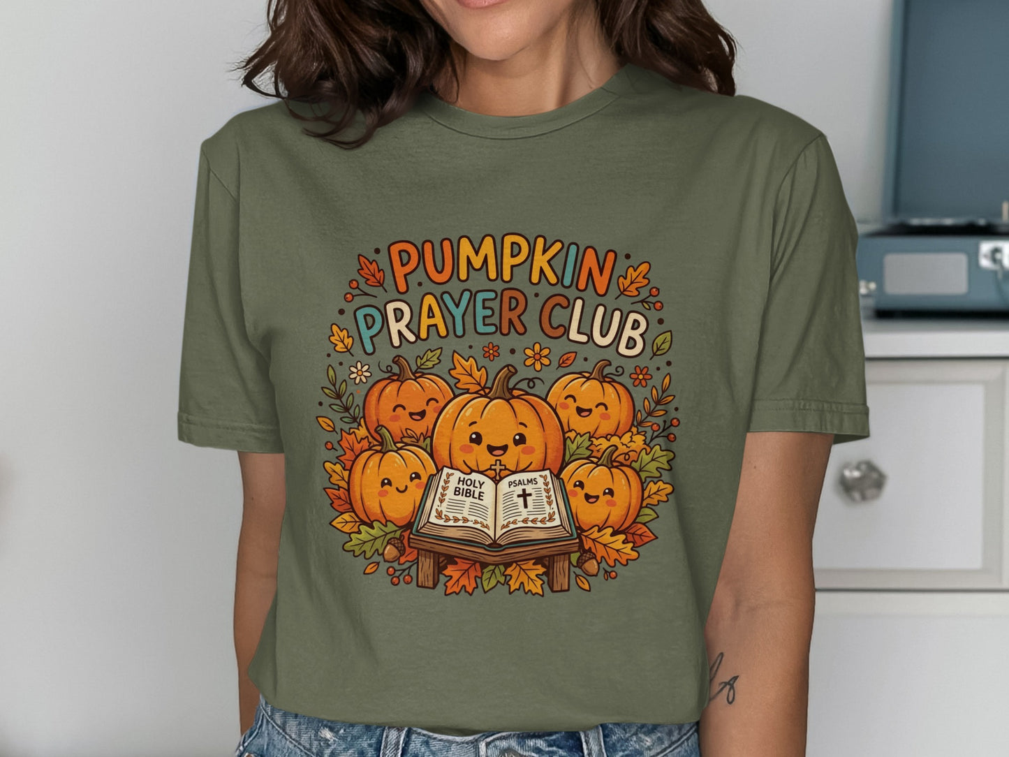 Crew neck t-shirt with "Pumpkin Prayer Club" and Bible illustration.