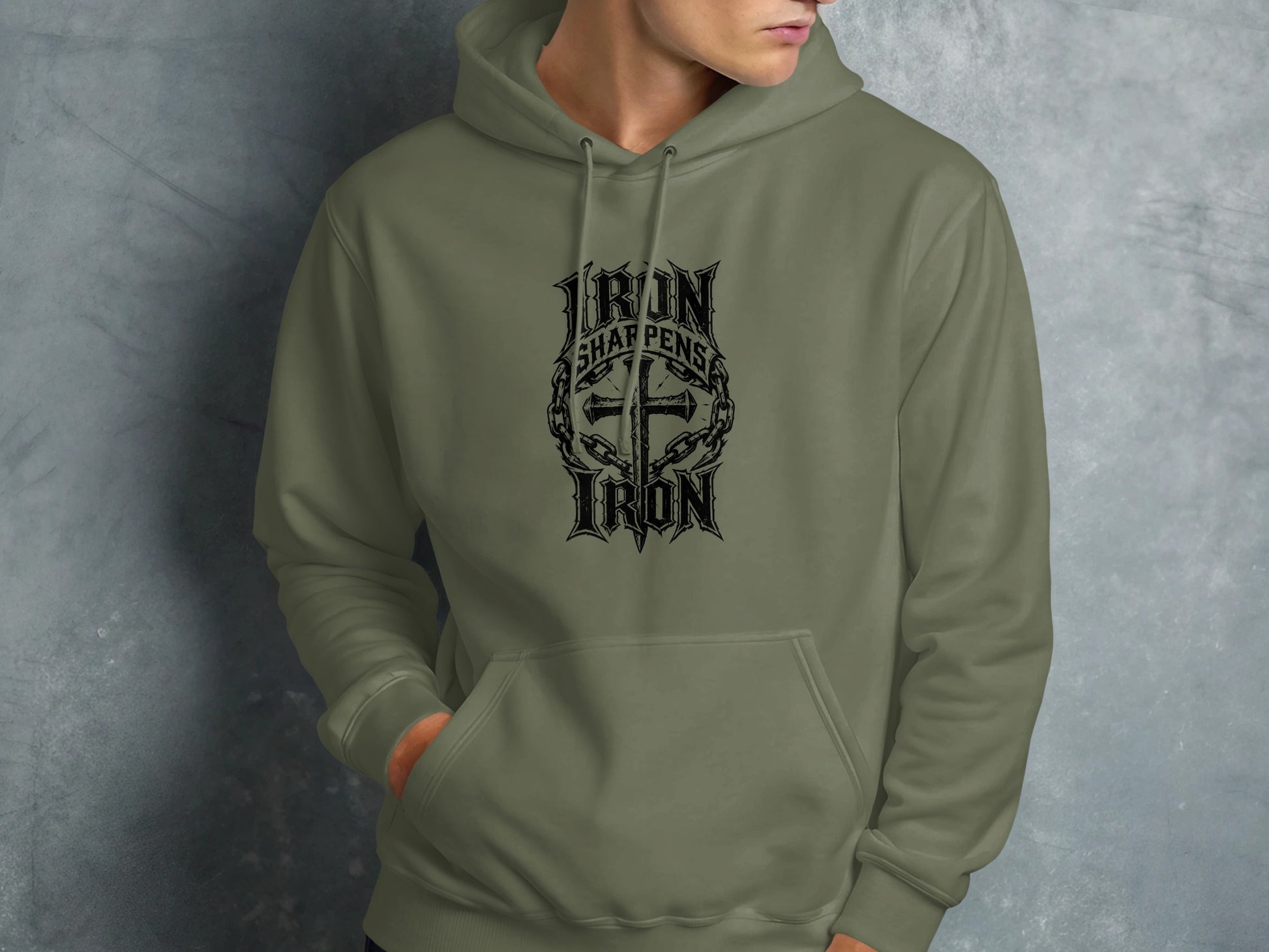 Green hoodie with "Iron Sharpens Iron" text and cross graphic.