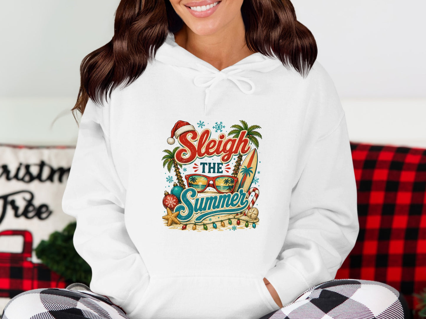 Christmas in July Santa hat, sunglasses, surfboard, and palm trees graphic on white hoodie.