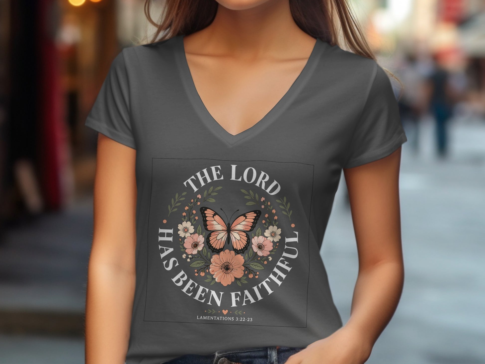 Gray v-neck t-shirt with "The Lord Has Been Faithful" text and butterfly floral design.
