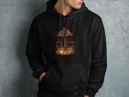Black hoodie featuring a Thanksgiving-themed graphic with pumpkins and "Gather, Give Thanks, Pray" text.
