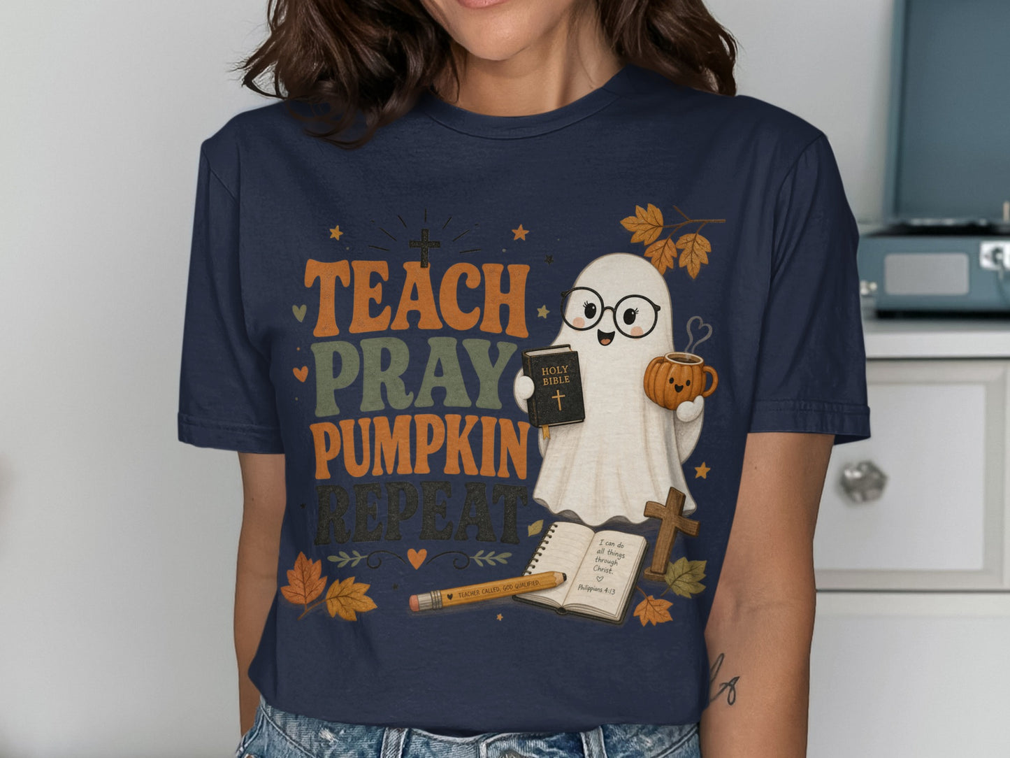 Ghost with pumpkin mug and Bible with "Teach Pray Pumpkin Repeat" text.