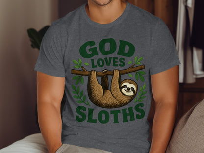 Dark grey t-shirt with green text "GOD LOVES SLOTHS" and a cartoon sloth.