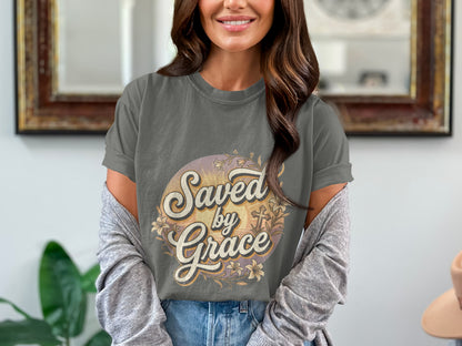 Gray t-shirt with "Saved by Grace" text and floral graphic.