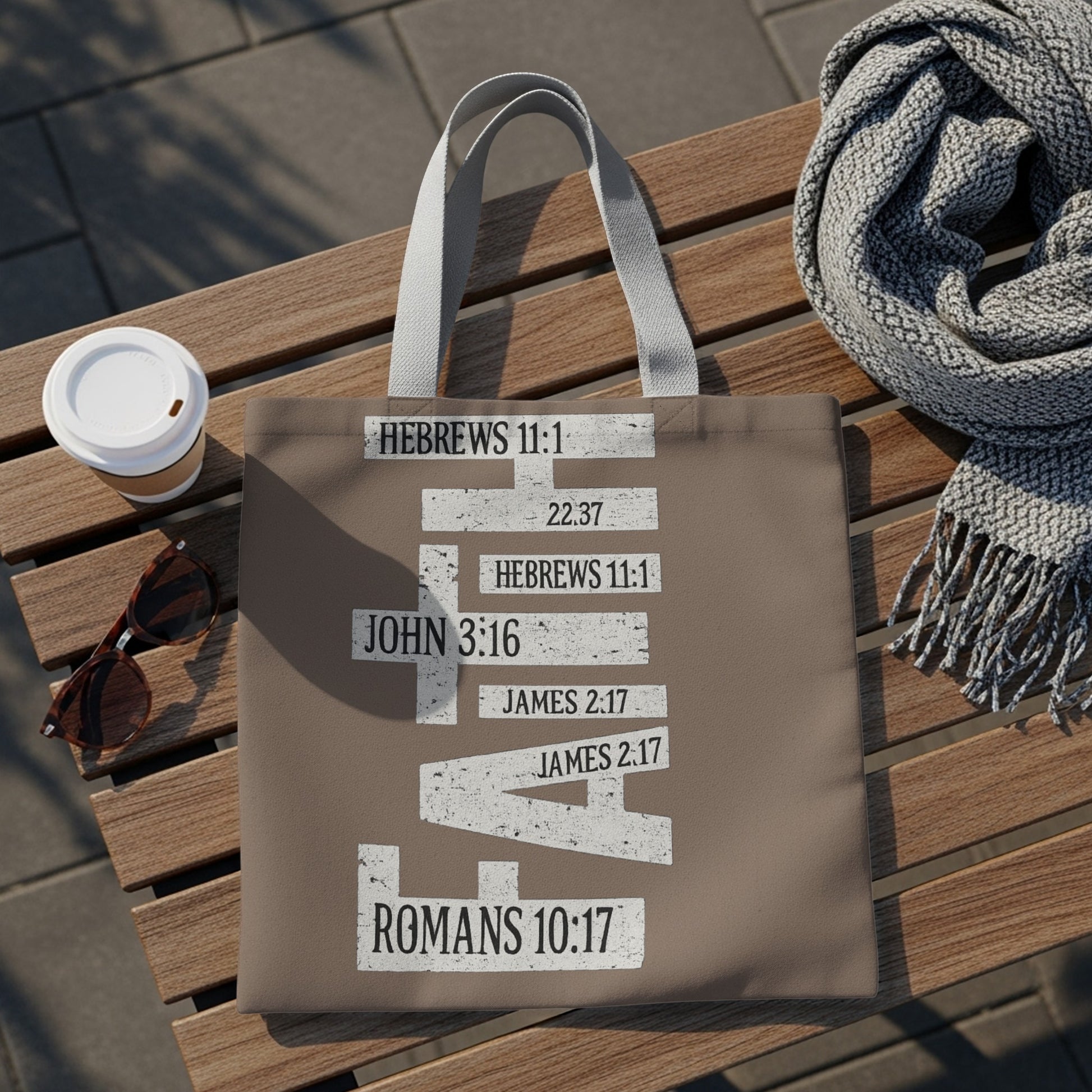 Brown tote bag with Bible verses HEBREWS 11:1, JOHN 3:16, and others.