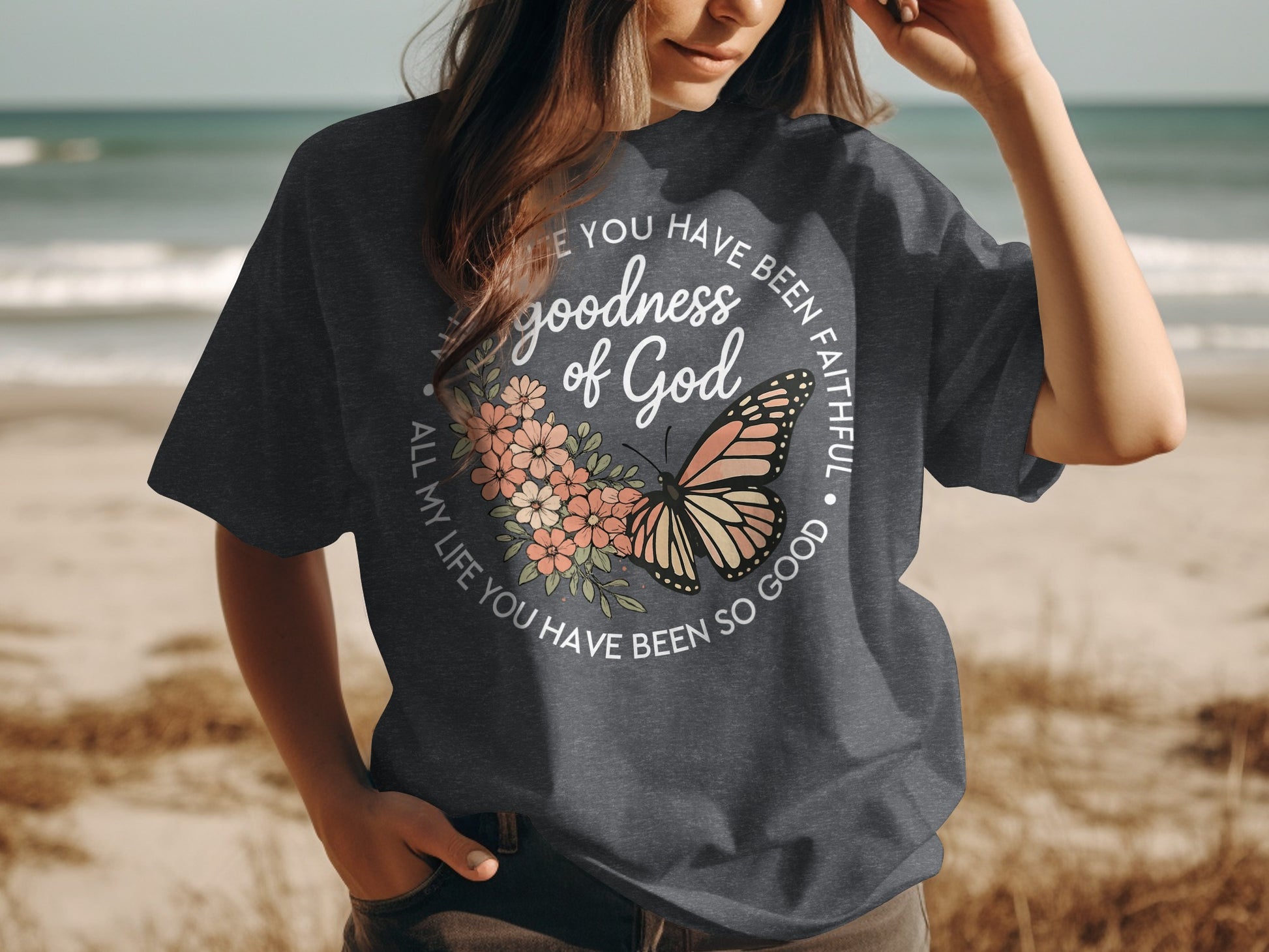 Dark gray t-shirt with butterfly and floral design, "goodness of God" and "All my life you have been so good."