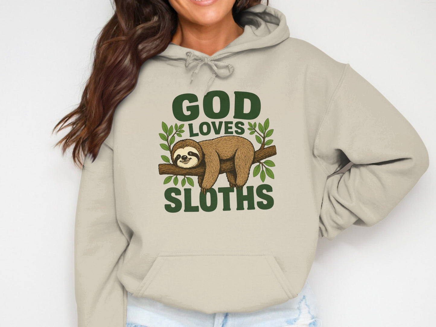 Beige hoodie with "GOD LOVES SLOTHS" graphic featuring a sloth on a branch.