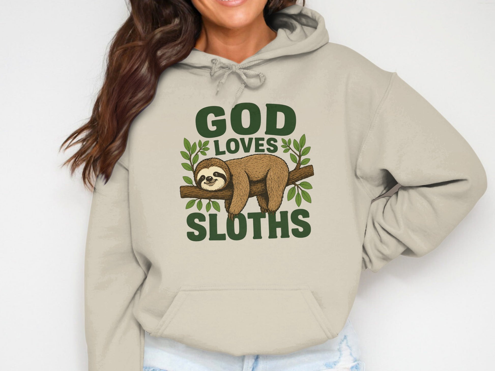 Beige hoodie with "GOD LOVES SLOTHS" graphic featuring a sloth on a branch.