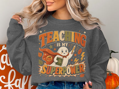 Ghost with cape holding book and pencil; text: Teaching is my superpower.