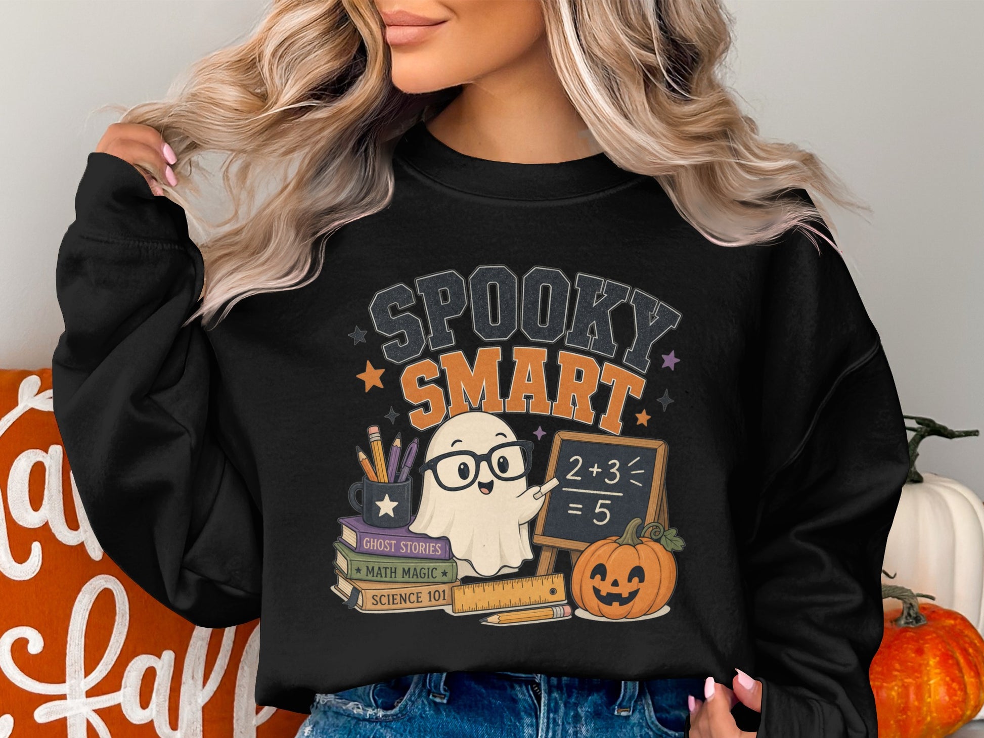 Spooky Smart ghost with glasses and pumpkin on a black sweatshirt.