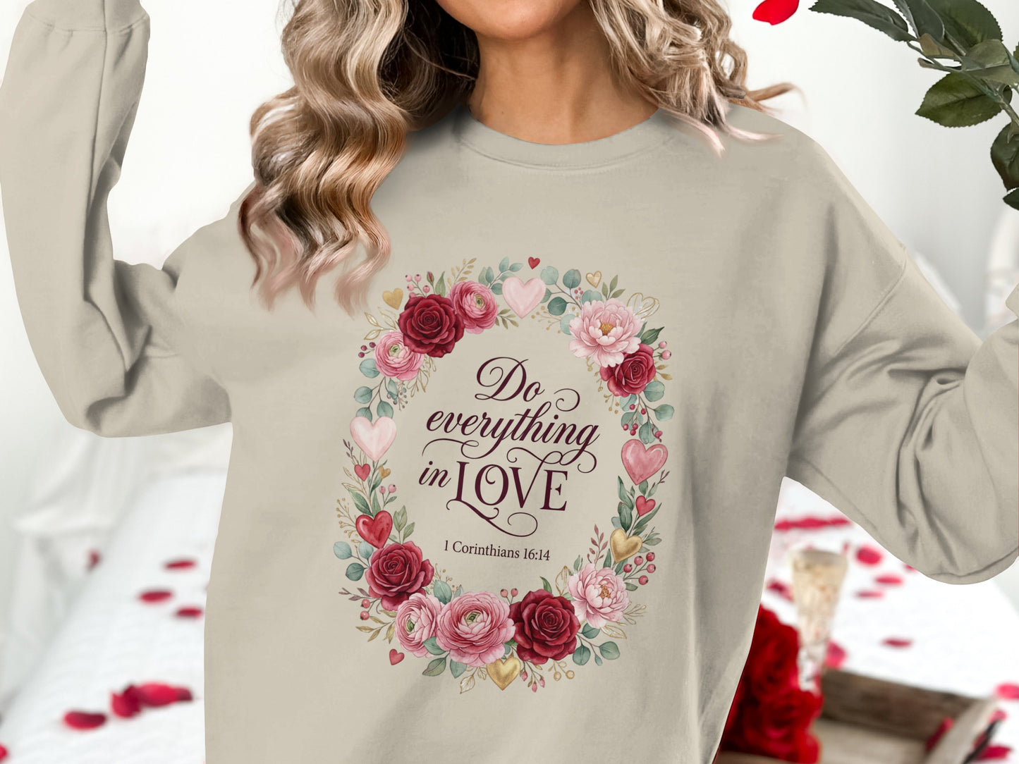 Crewneck sweatshirt with floral wreath and "Do everything in Love" text.