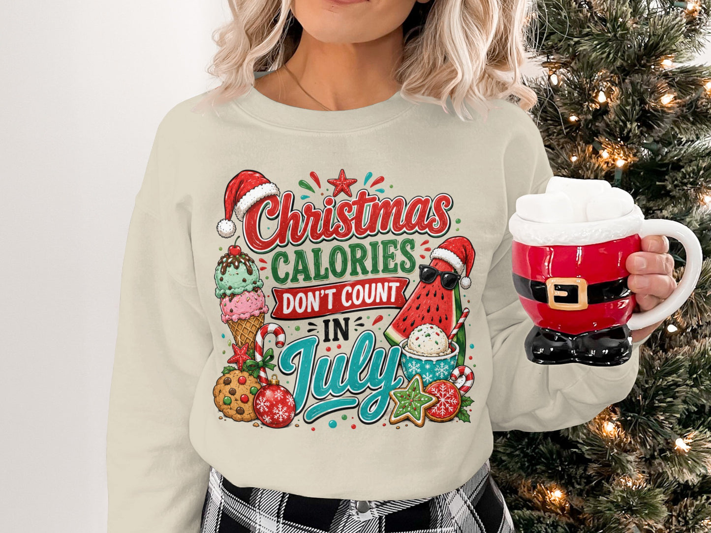 Cream sweatshirt with Christmas in July graphic featuring ice cream, watermelon, and cookies.