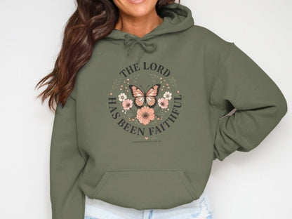 Olive green hoodie with circular text and butterfly design.