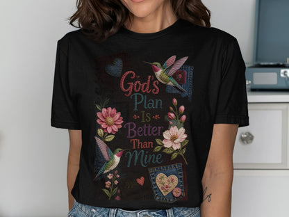 Black t-shirt with floral and hummingbird design and "God's Plan Is Better Than Mine" text.