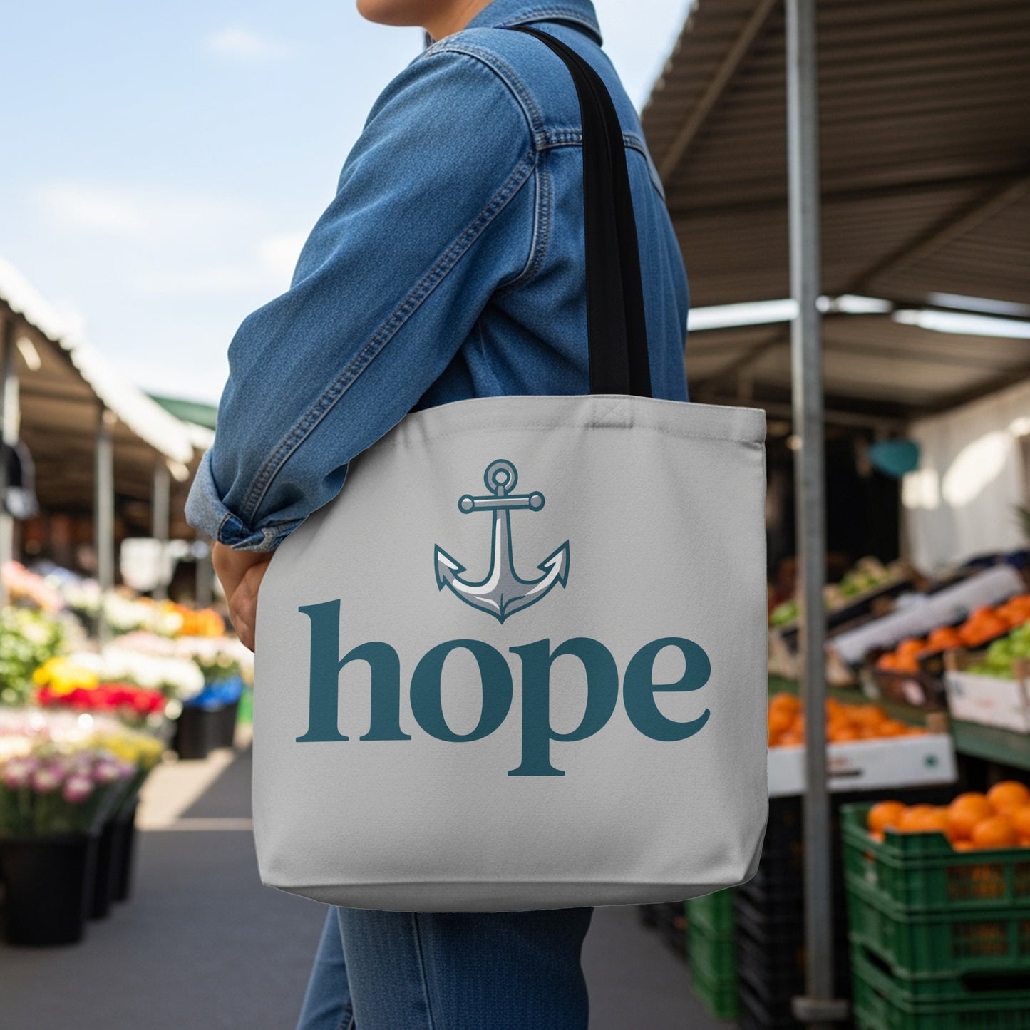 Tote bag with anchor and "hope" text on a light grey background.