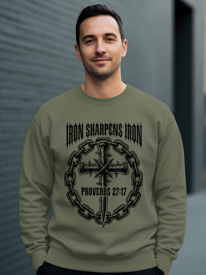 Man wearing olive green sweatshirt with "Iron Sharpens Iron" and cross design.