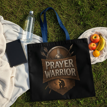 Black tote bag with "PRAYER WARRIOR" text and kneeling figure graphic.