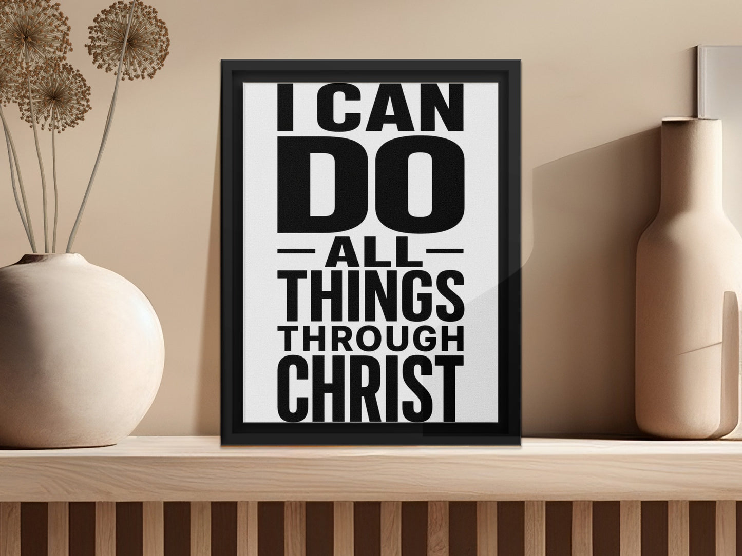 Framed artwork with text "I CAN DO ALL THINGS THROUGH CHRIST" on a shelf.