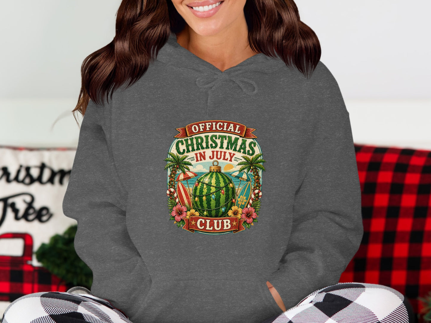Dark grey hoodie featuring a circular graphic with "Official Christmas in July Club" text.