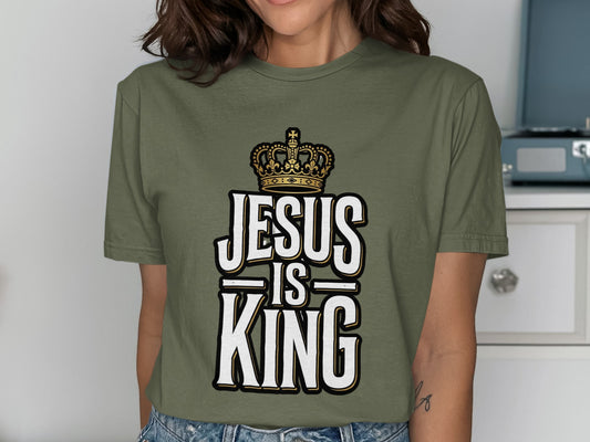 Green t-shirt with "Jesus is King" and a crown graphic.