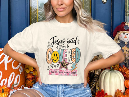 Cream t-shirt with text "Jesus said I'm Covered" and "no stress over here".