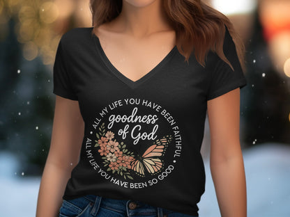 Black v-neck t-shirt with floral and butterfly graphic, "Goodness of God" text.