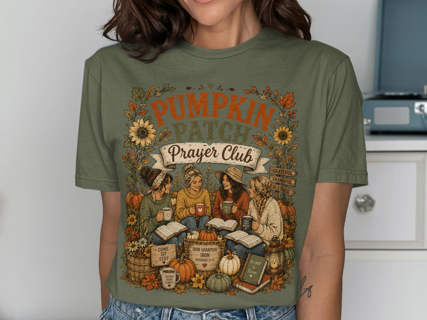 T-shirt with "Pumpkin Patch Prayer Club" text, sunflowers, and women reading.