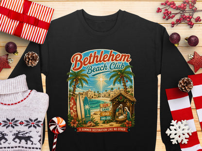 Bethlehem Beach Club with nativity scene, palm trees, and beach in sunset.