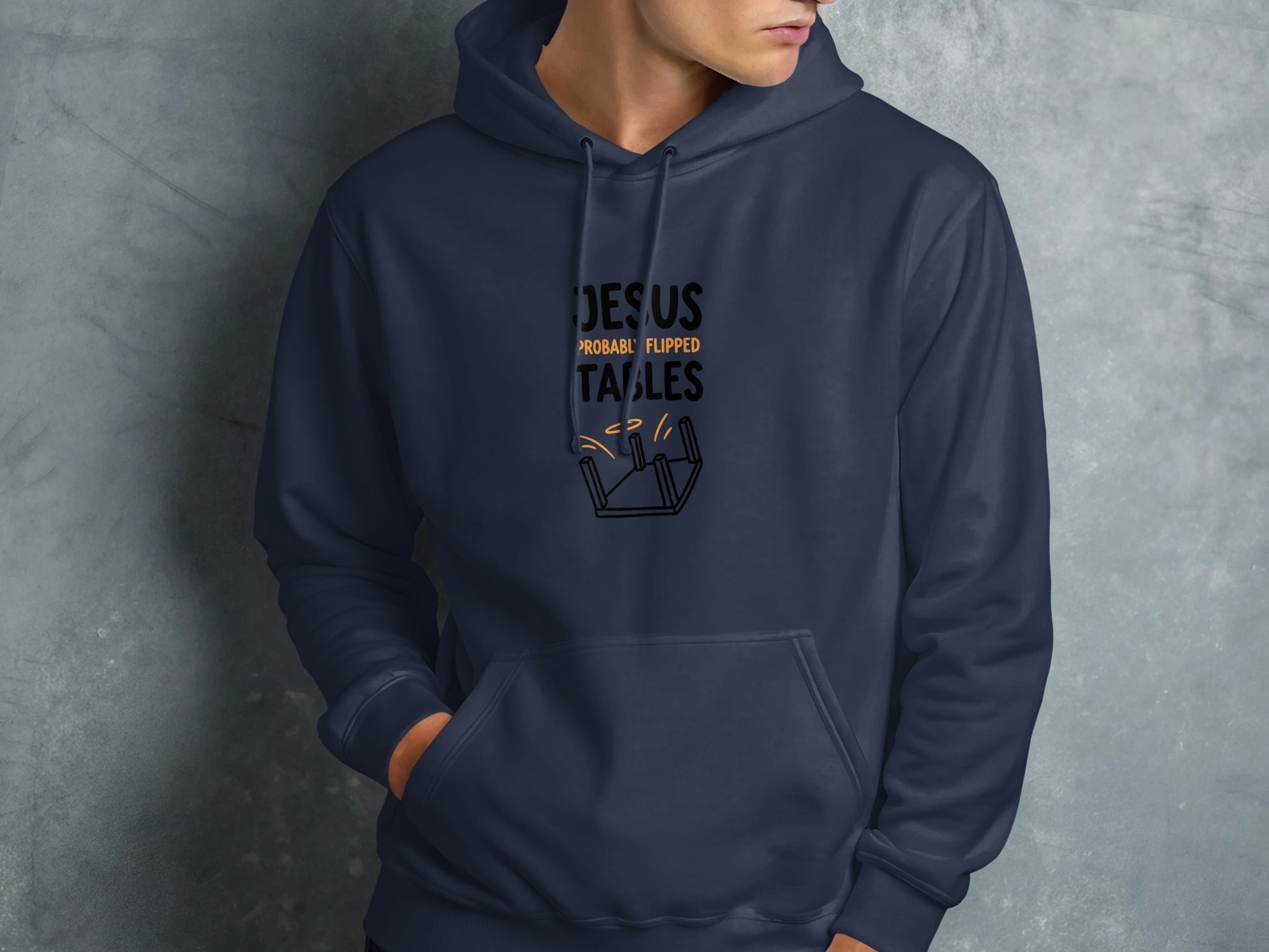 Navy hoodie with text "JESUS PROBABLY FLIPPED TABLES" and illustration.