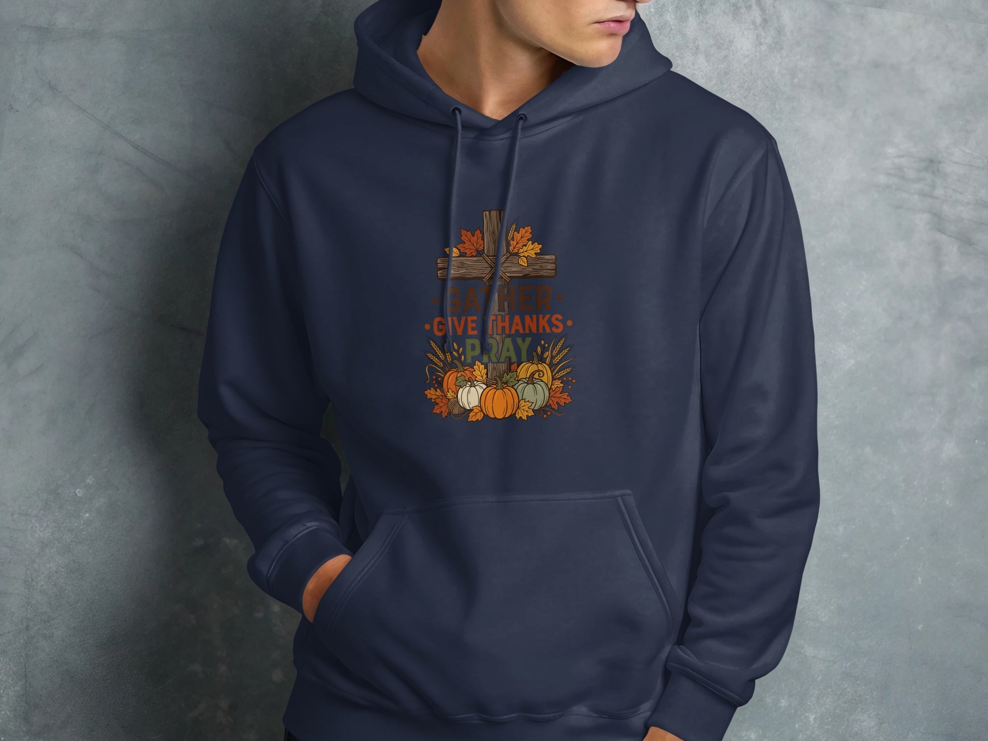 Navy hoodie with Thanksgiving graphic featuring a cross, pumpkins, and leaves.