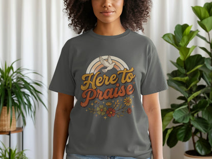 Grey t-shirt with "Here to Praise" text, a dove, rainbow and floral graphic.