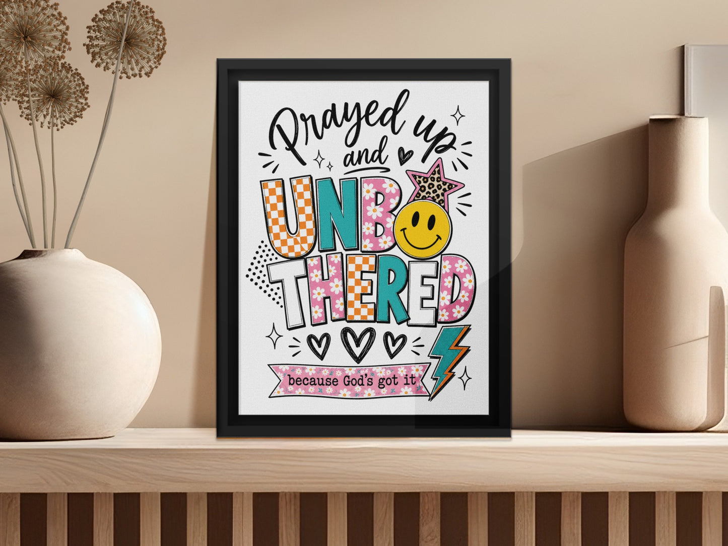 Framed art with "Prayed up and UNBOTHERED because God's got it" text.