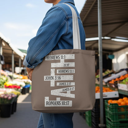 Brown tote bag with "FAITH" made of Bible verses in white text.