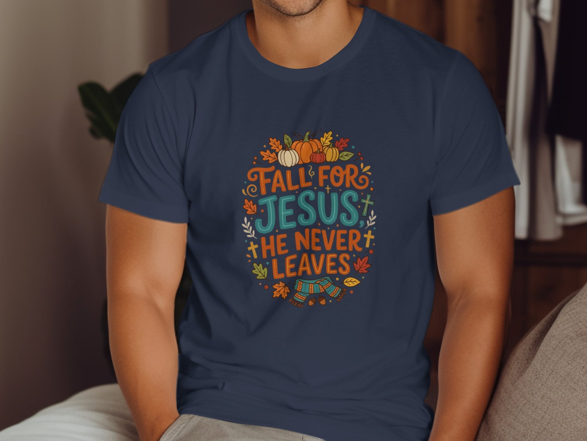 Navy t-shirt with "Fall for Jesus he never leaves" text and autumn motifs.
