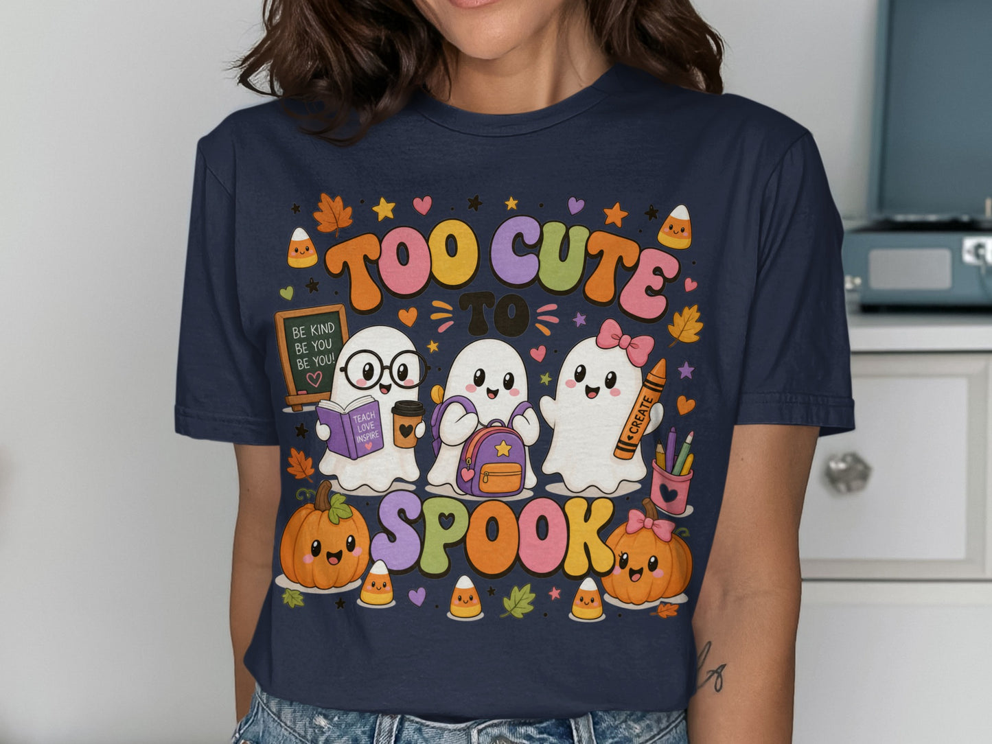 Three ghosts, pumpkins, and candy corn with "Too Cute to Spook" text.