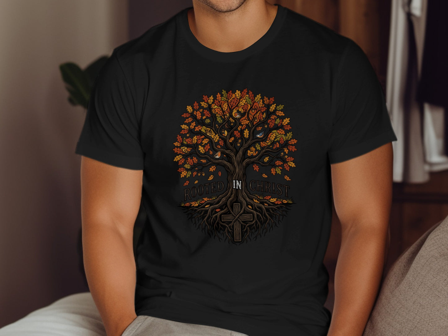 Black t-shirt with a colorful tree and cross graphic saying "Rooted in Christ".