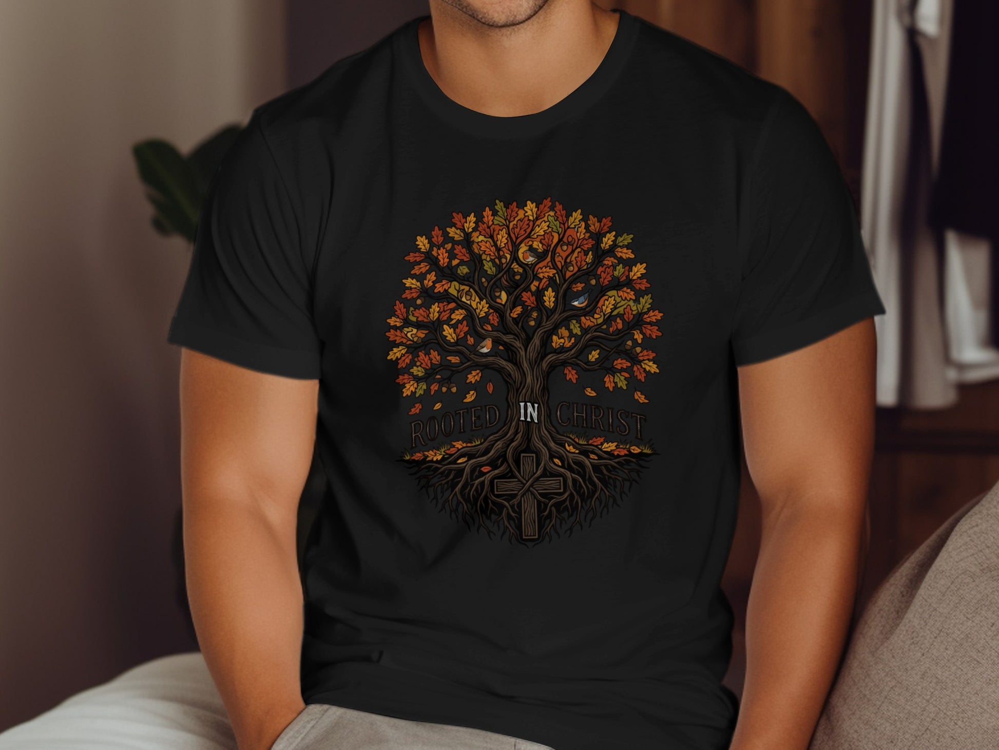 Black t-shirt with a colorful tree and cross graphic saying "Rooted in Christ".