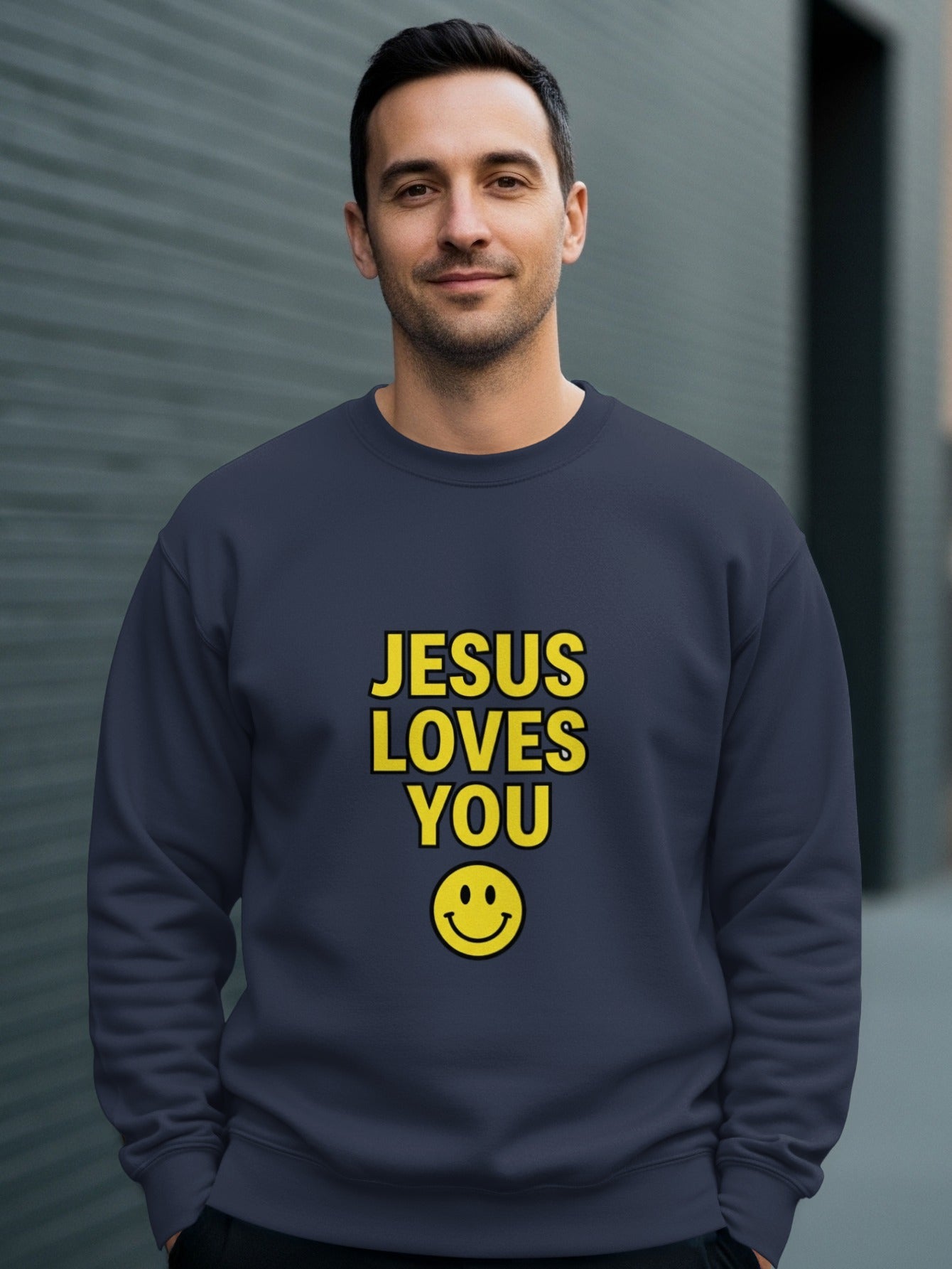 Dark navy sweatshirt with yellow "JESUS LOVES YOU" text and smiley face.